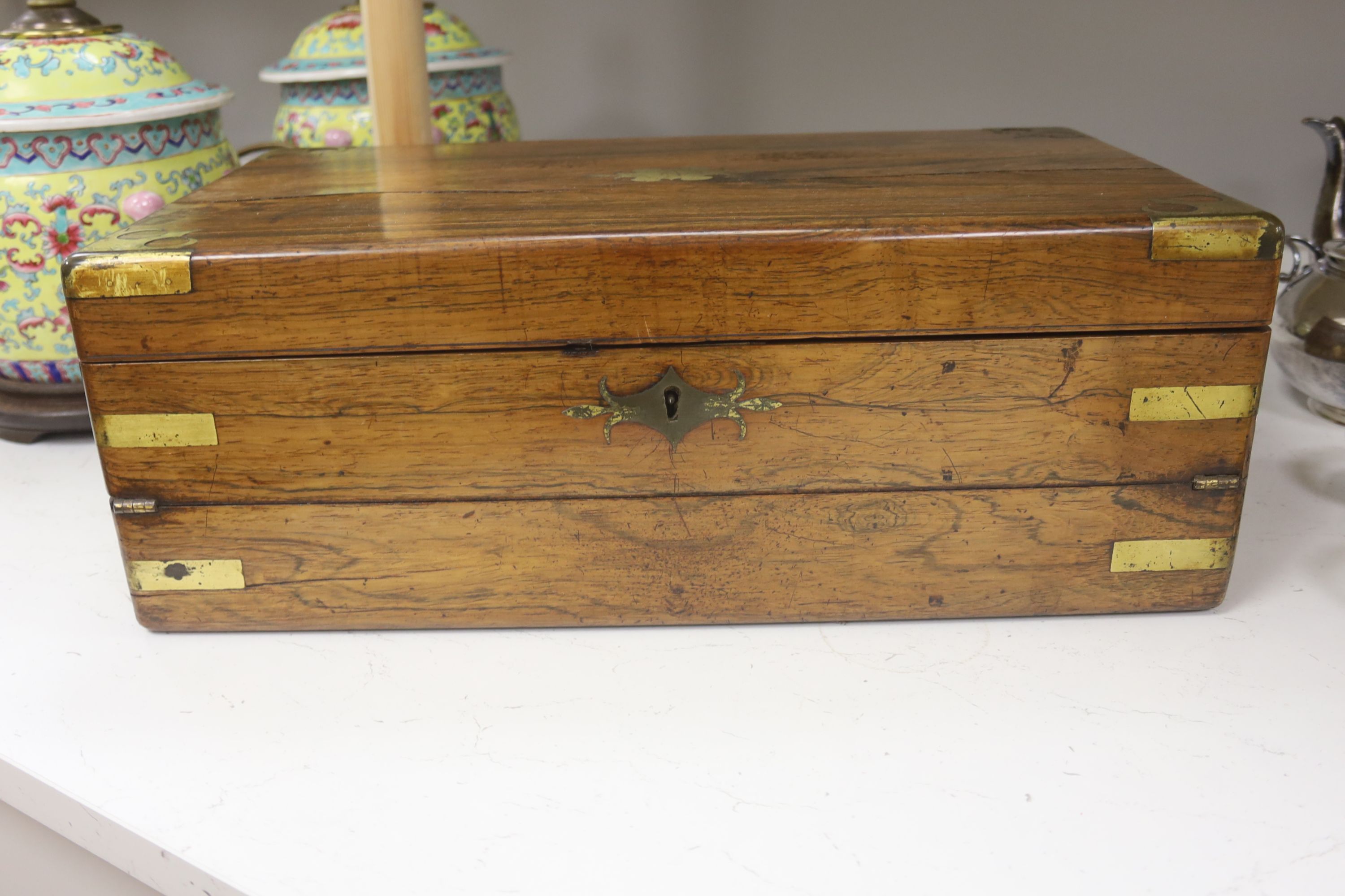 An early Victorian brass bound rosewood writing box